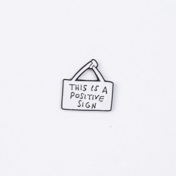 This is a Positive Sign Enamel Pin - #178